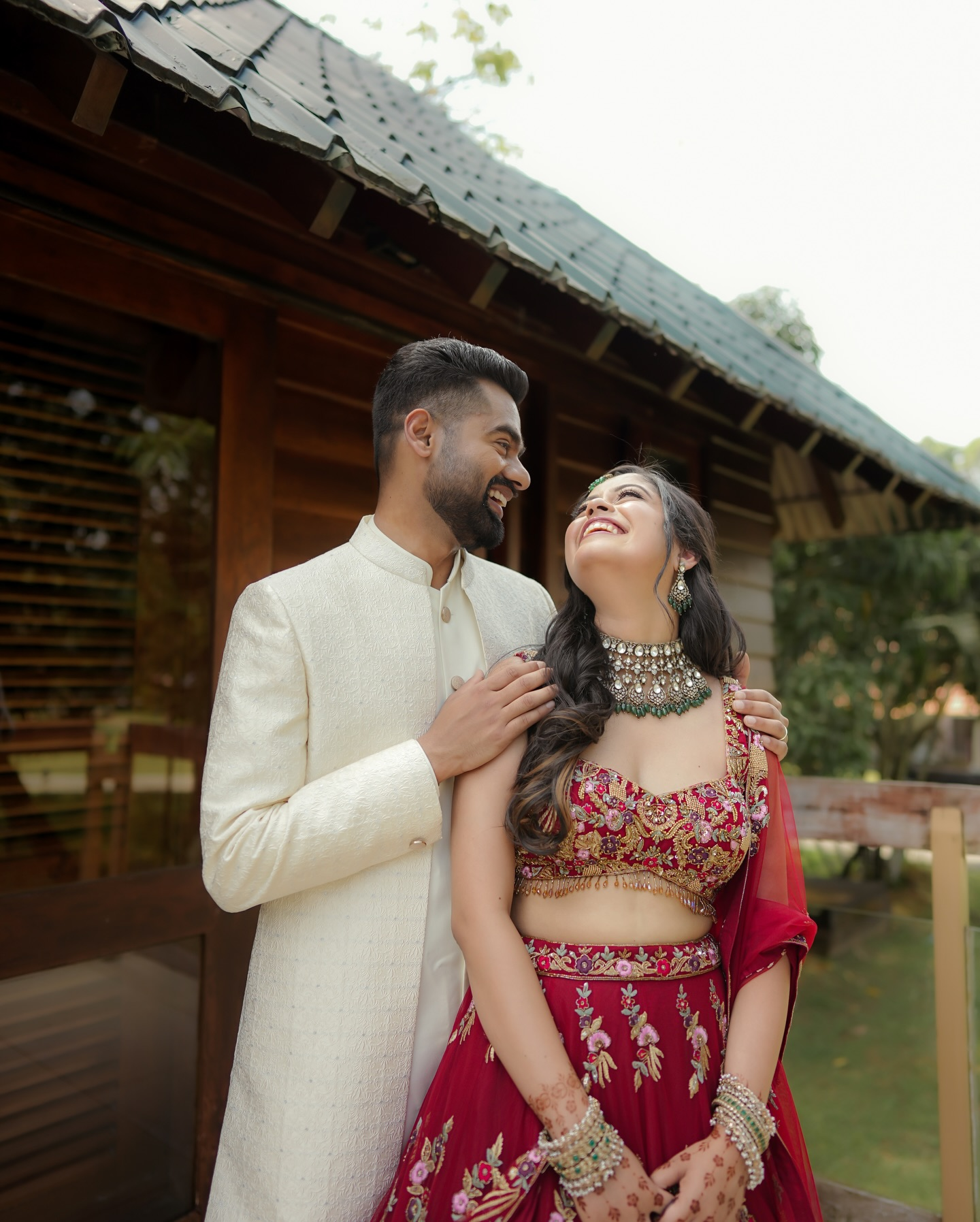 A couple laughing together in their wedding attire